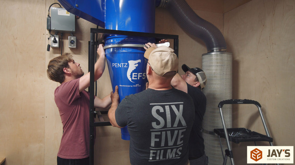 Men installing a cyclone system.